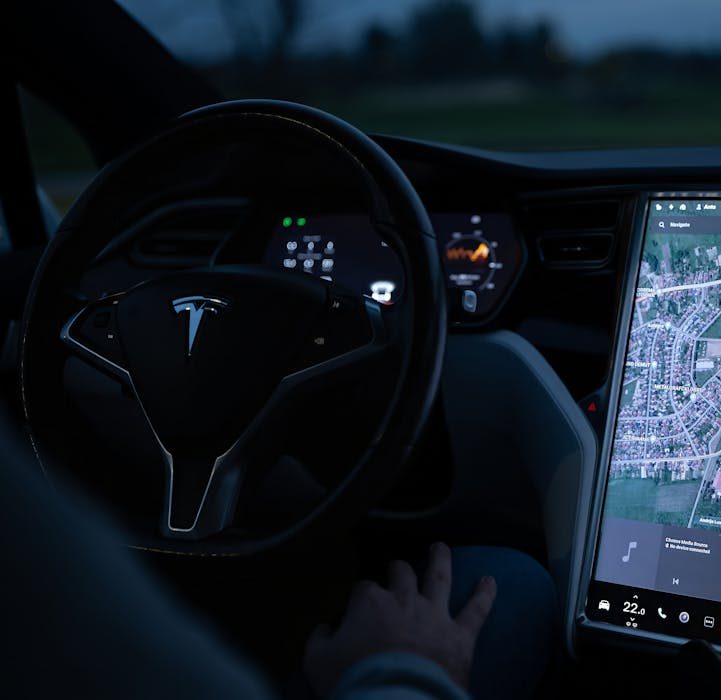 Tesla interior with its touchscreen and steering wheel