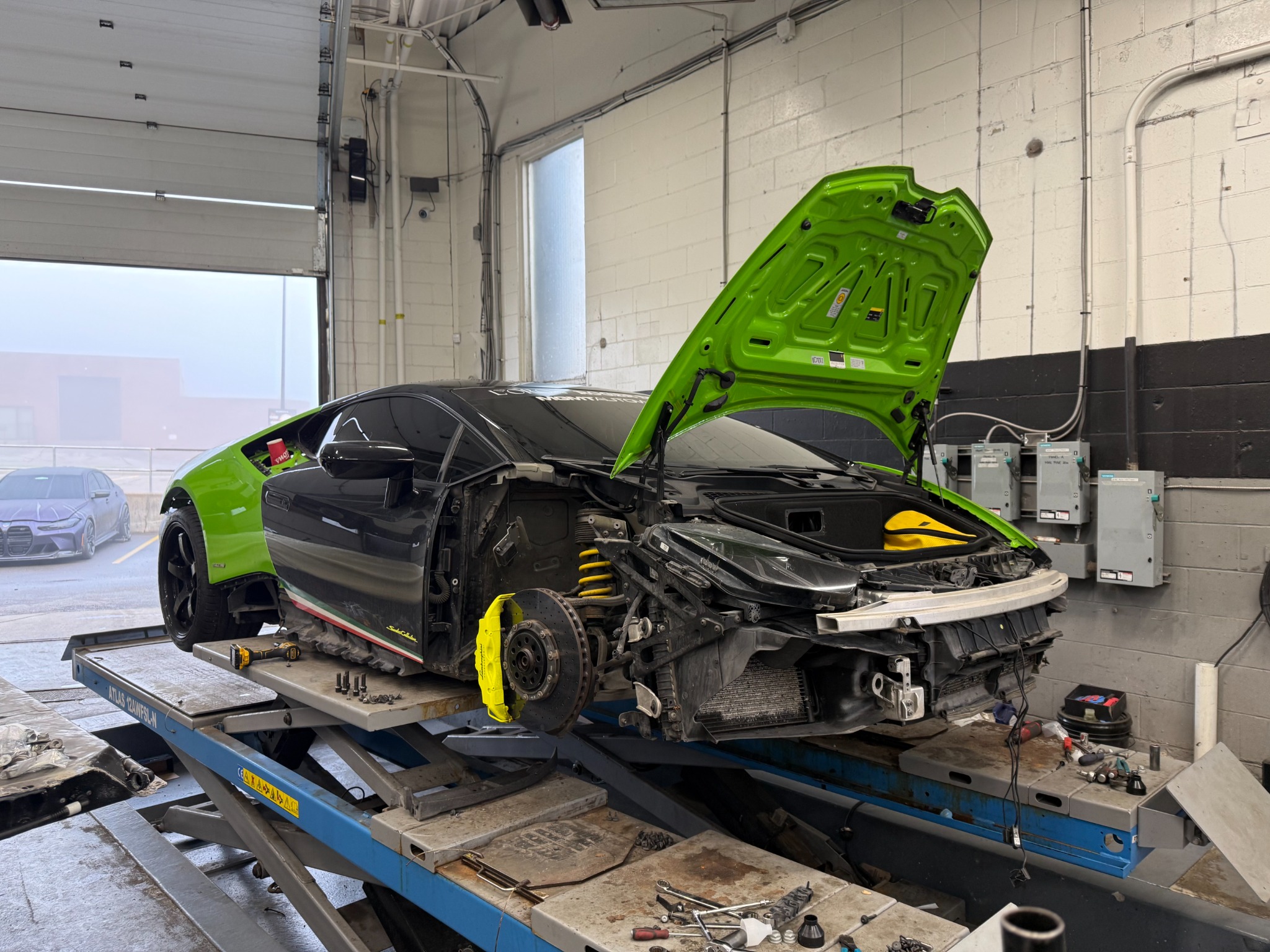 The Huracán on the hoist as the body transformation progresses.
