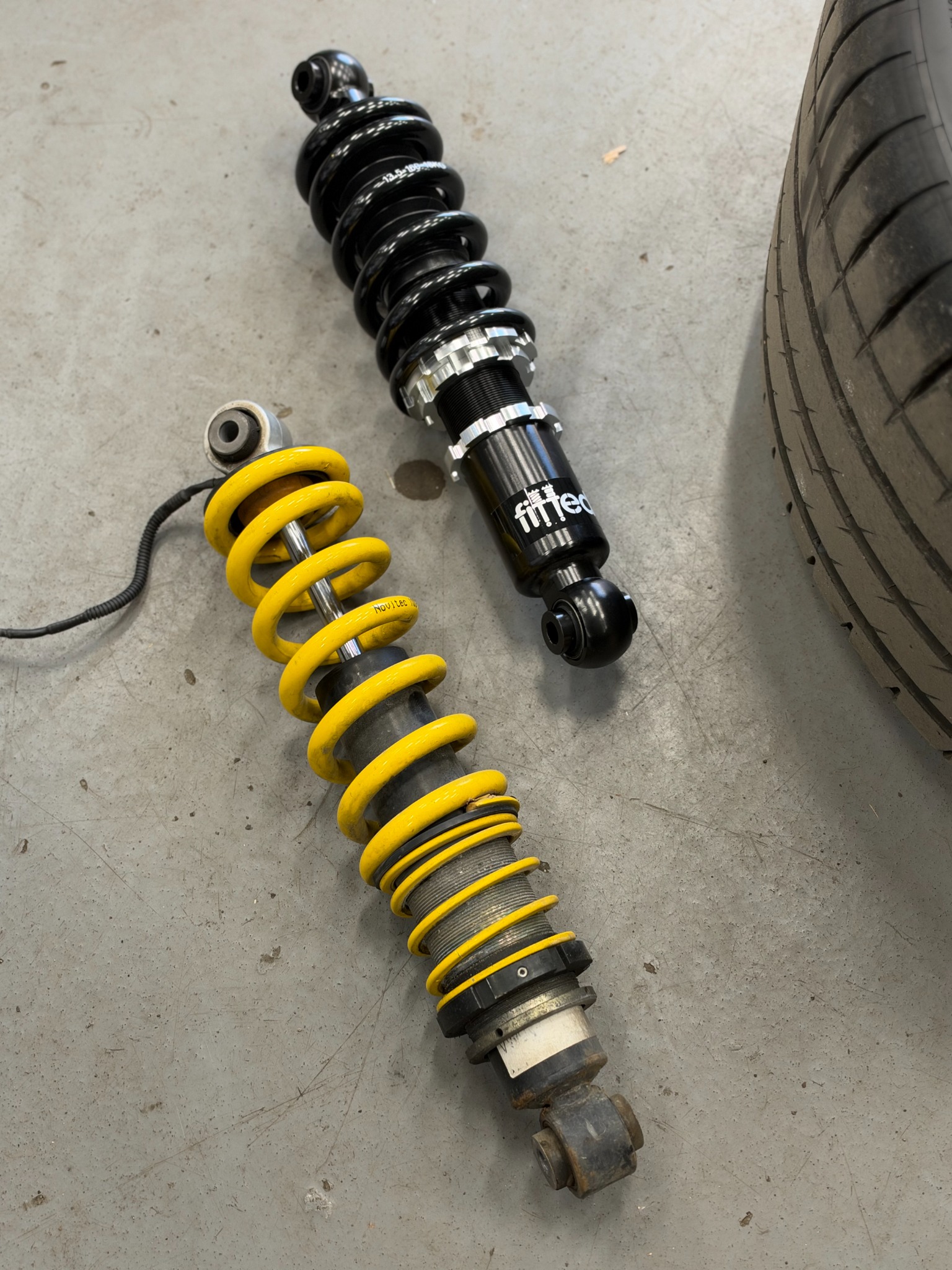 Suspension components side by side during the upgrade.